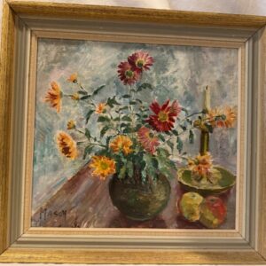 Flowers in vase with candlestick and apples